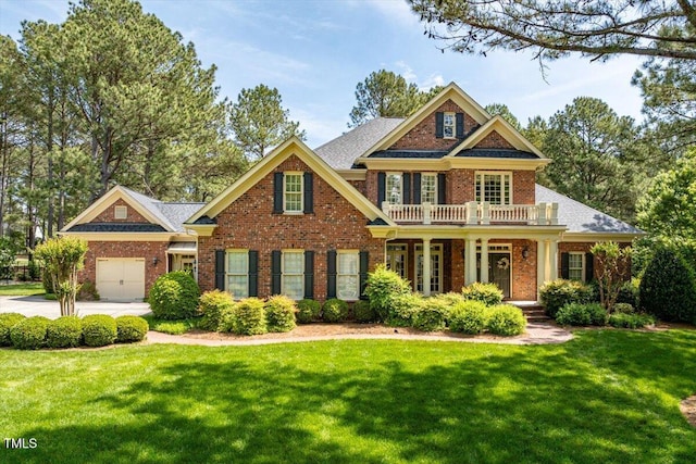 1317 Colonial Club Rd, Wake Forest, NC 27587 - craftsman-style house featuring a garage, brick siding, a porch, and a front yard