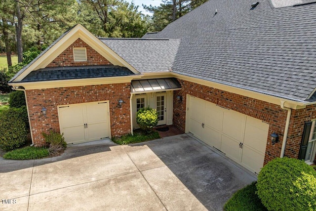 1317 Colonial Club Rd, Wake Forest, NC 27587 - view of front of property featuring driveway, roof with shingles, an attached garage, and brick siding