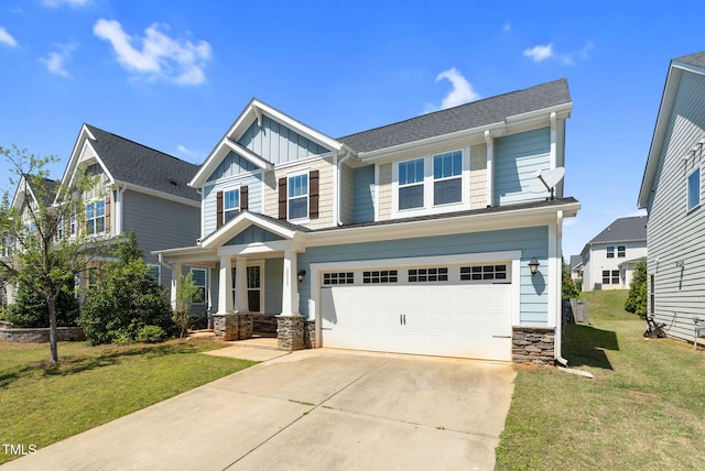 craftsman-style home featuring a front lawn, stone siding, board and batten siding, and a garage