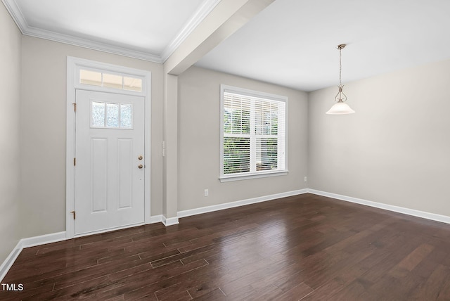 foyer entrance with dark wood-style floors, baseboards, and ornamental molding