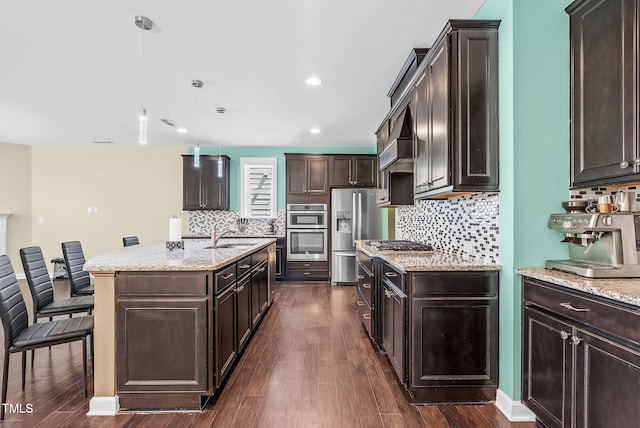 kitchen featuring stainless steel appliances, dark wood-style floors, and dark brown cabinetry