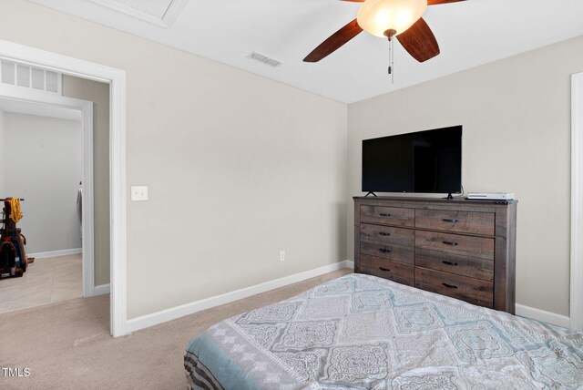 bedroom featuring carpet flooring, a ceiling fan, visible vents, and baseboards
