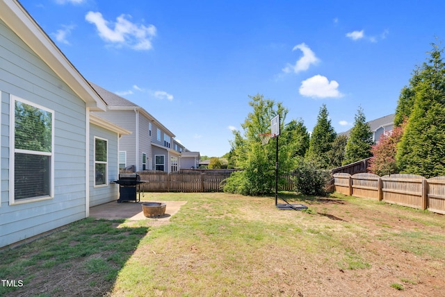 view of yard with a fenced backyard and a patio area