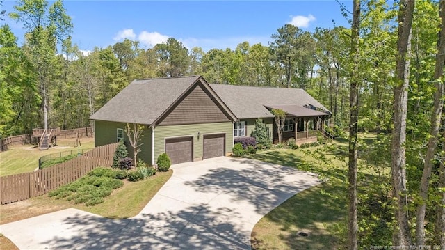 626 Bailey Rd, Coats, NC 27521 - craftsman-style house featuring an attached garage, fence, driveway, and a front lawn