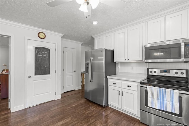 626 Bailey Rd, Coats, NC 27521 - kitchen with white cabinets, dark wood finished floors, stainless steel appliances, light countertops, and ceiling fan