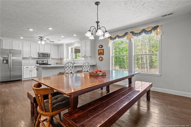 626 Bailey Rd, Coats, NC 27521 - dining room with a chandelier, a textured ceiling, visible vents, and baseboards