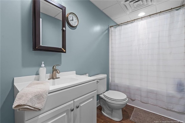 626 Bailey Rd, Coats, NC 27521 - full bath featuring wood finished floors, vanity, visible vents, toilet, and shower / bath combo with shower curtain
