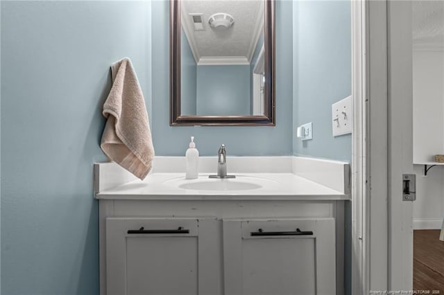 626 Bailey Rd, Coats, NC 27521 - bathroom featuring crown molding, vanity, a textured ceiling, and visible vents