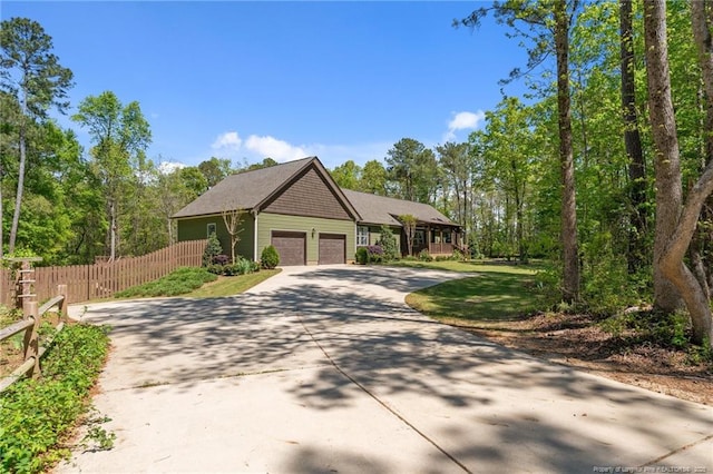 626 Bailey Rd, Coats, NC 27521 - view of front of house with concrete driveway, fence, and a garage