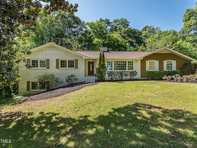 3009 Hillmer Dr, Raleigh, NC 27609 - ranch-style home with a front lawn and a chimney