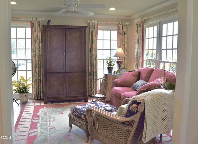 775 Sid Eaves Rd, Youngsville, NC 27596 - living room featuring a ceiling fan, a wealth of natural light, crown molding, and recessed lighting