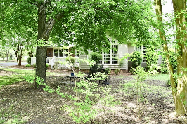 775 Sid Eaves Rd, Youngsville, NC 27596 - view of yard featuring a porch