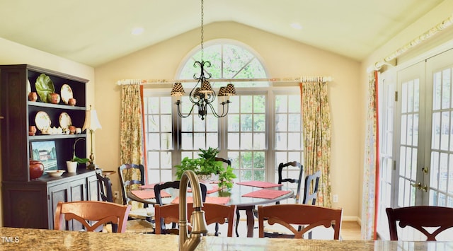 775 Sid Eaves Rd, Youngsville, NC 27596 - dining area with a chandelier, wood finished floors, lofted ceiling, baseboards, and french doors