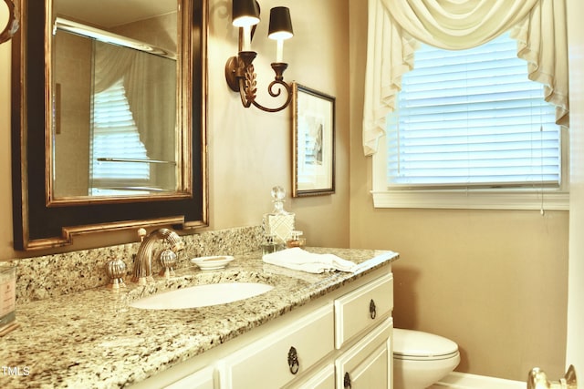 775 Sid Eaves Rd, Youngsville, NC 27596 - bathroom featuring toilet, a shower stall, and vanity