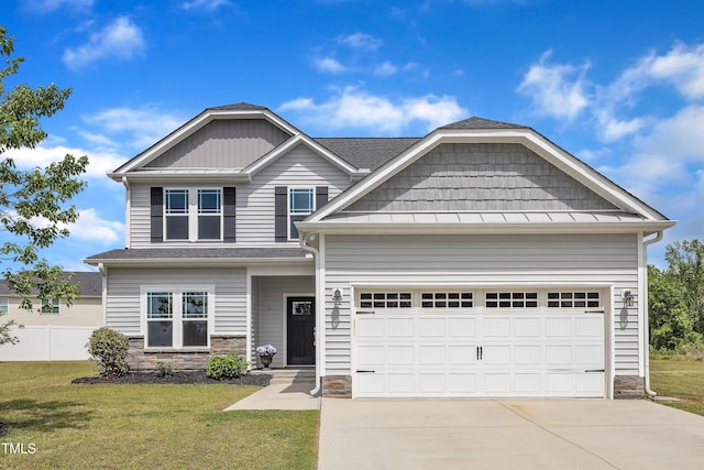craftsman inspired home featuring concrete driveway, stone siding, and a front yard