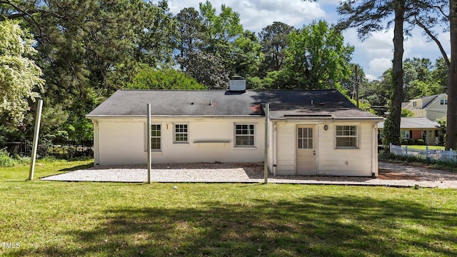 207 N Aiken St, Fuquay Varina, NC 27526 - back of house with a lawn, fence, a chimney, and a patio