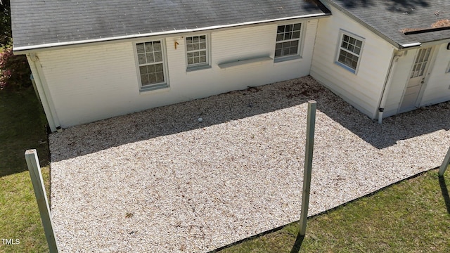 207 N Aiken St, Fuquay Varina, NC 27526 - view of side of home with brick siding and a shingled roof