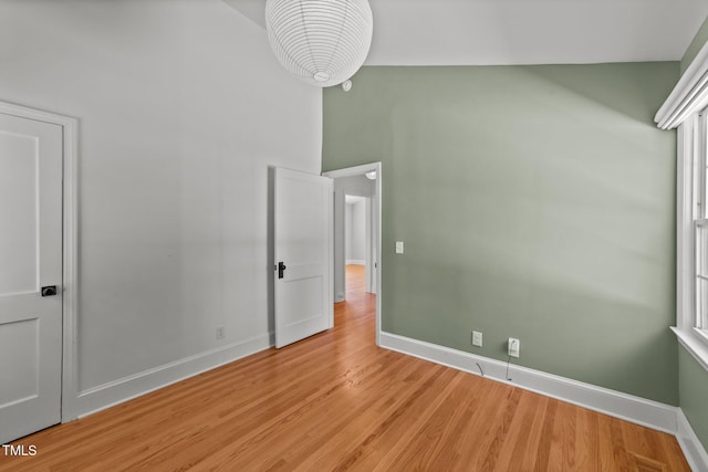 207 N Aiken St, Fuquay Varina, NC 27526 - unfurnished bedroom featuring baseboards and light wood-style floors
