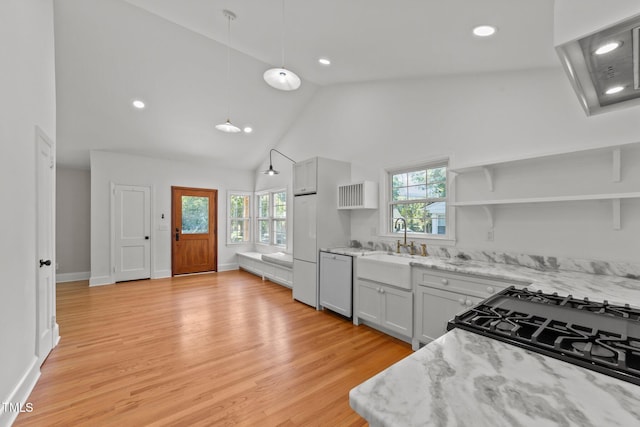 207 N Aiken St, Fuquay Varina, NC 27526 - kitchen featuring open shelves, high vaulted ceiling, light stone counters, a sink, and dishwasher