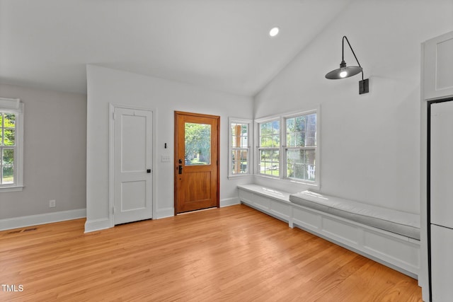 207 N Aiken St, Fuquay Varina, NC 27526 - entrance foyer with visible vents, baseboards, high vaulted ceiling, recessed lighting, and light wood-style flooring