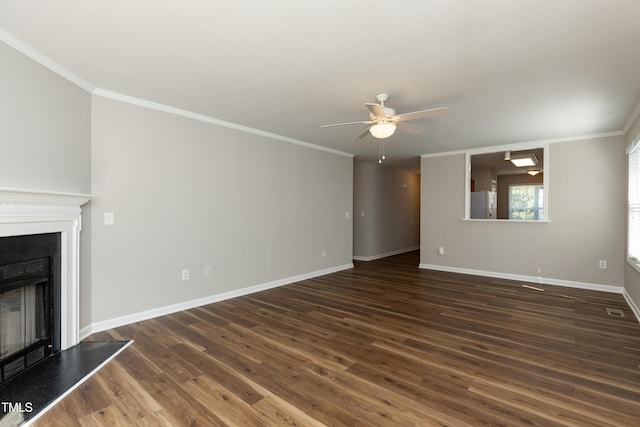 518 S Coalport Dr, Apex, NC 27502 - unfurnished living room featuring a fireplace with raised hearth, a ceiling fan, crown molding, dark wood-style flooring, and baseboards