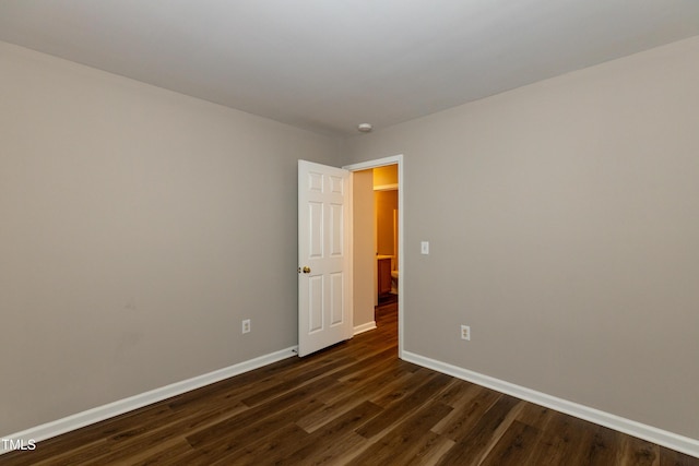 518 S Coalport Dr, Apex, NC 27502 - empty room featuring baseboards, dark wood-type flooring, and a smoke detector