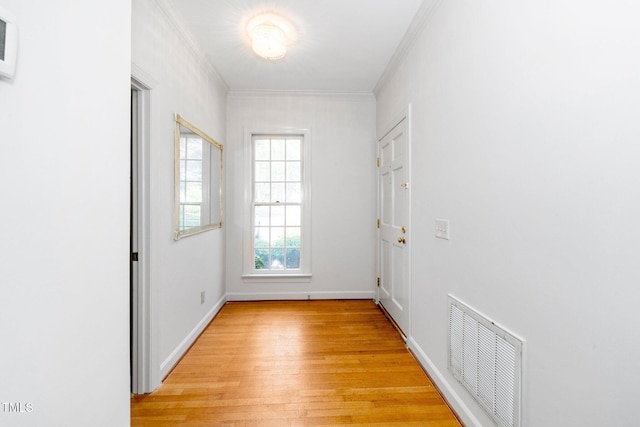 6000 Tenter Banks Sq, Raleigh, NC 27609 - entryway with crown molding, baseboards, visible vents, and light wood finished floors