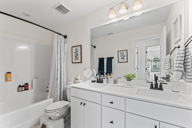 full bathroom featuring toilet, shower / bathtub combination with curtain, and double vanity