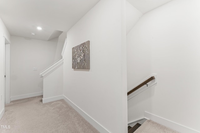 stairs with baseboards, carpet flooring, and recessed lighting