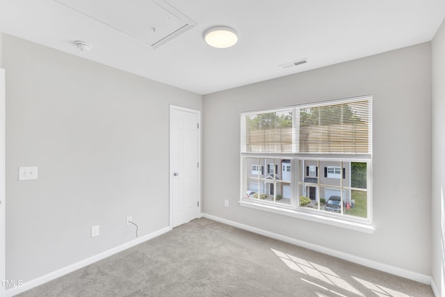 2705 Wyntercrest Ln, Durham, NC 27713 - spare room with carpet flooring, baseboards, visible vents, and attic access