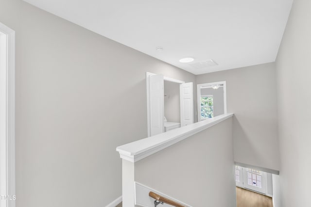 2705 Wyntercrest Ln, Durham, NC 27713 - corridor featuring baseboards, light wood-style floors, and an upstairs landing