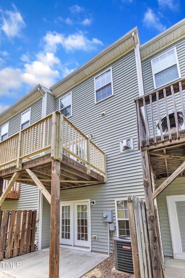 2705 Wyntercrest Ln, Durham, NC 27713 - back of property with a patio area, a deck, and cooling unit