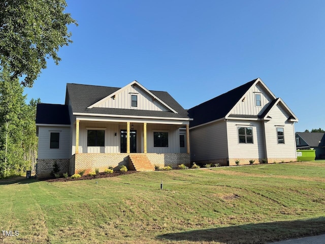 27 Batten Hill Ln, Selma, NC 27576 - modern farmhouse style home featuring board and batten siding, covered porch, and a front yard