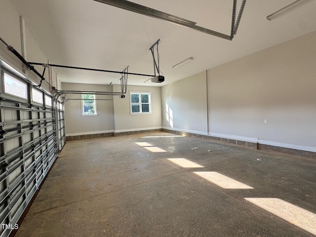 27 Batten Hill Ln, Selma, NC 27576 - garage with a garage door opener and baseboards