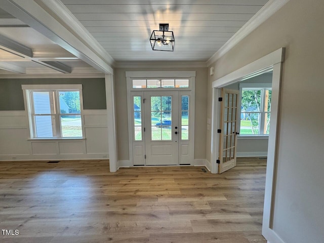 27 Batten Hill Ln, Selma, NC 27576 - foyer entrance with ornamental molding, wood finished floors, and wainscoting