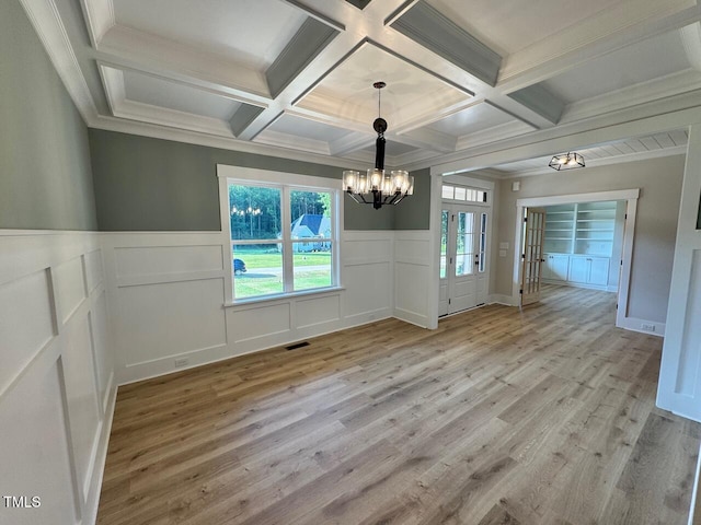 27 Batten Hill Ln, Selma, NC 27576 - unfurnished dining area featuring coffered ceiling, a chandelier, light wood-style floors, a decorative wall, and beam ceiling