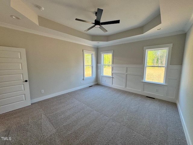 27 Batten Hill Ln, Selma, NC 27576 - carpeted spare room with a tray ceiling, ceiling fan, wainscoting, ornamental molding, and recessed lighting