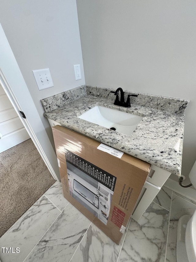 27 Batten Hill Ln, Selma, NC 27576 - half bathroom with vanity and marble finish flooring