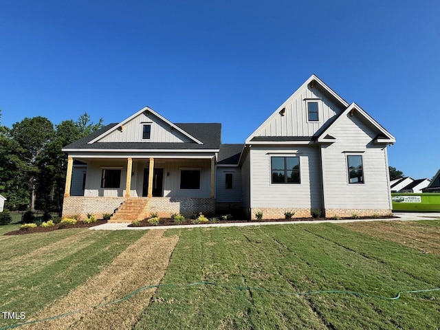 27 Batten Hill Ln, Selma, NC 27576 - modern inspired farmhouse with board and batten siding, covered porch, and a front yard