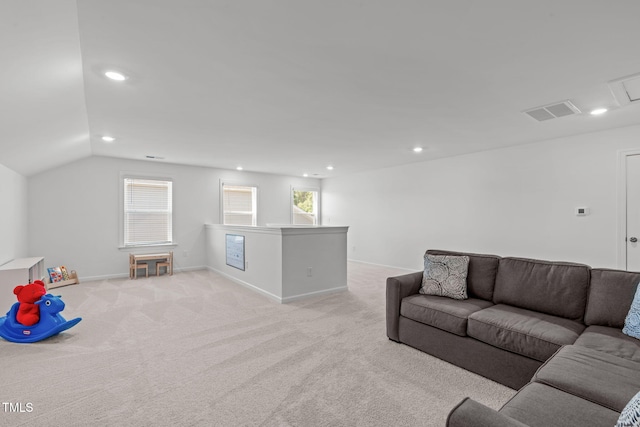 living room featuring recessed lighting, visible vents, light carpet, and lofted ceiling