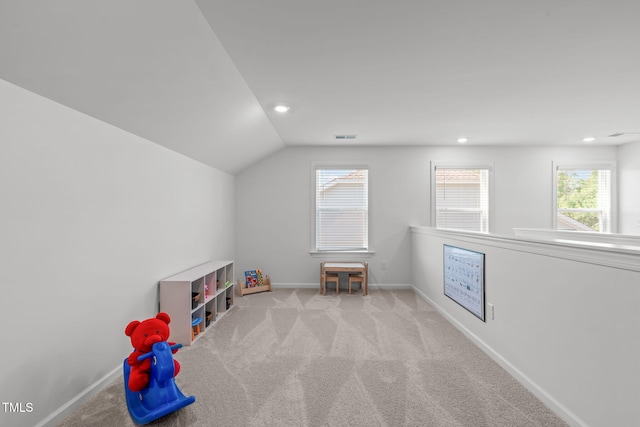 rec room featuring carpet flooring, recessed lighting, baseboards, lofted ceiling, and visible vents
