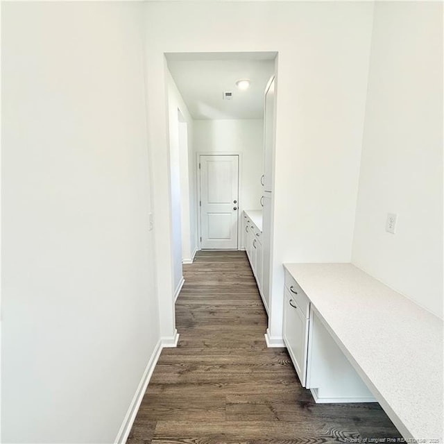 132 Cahill, Home, Raeford, NC 28376 - corridor featuring dark wood-type flooring and baseboards