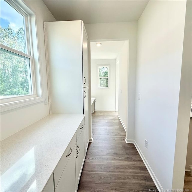 132 Cahill, Home, Raeford, NC 28376 - hallway with dark wood-style flooring and baseboards