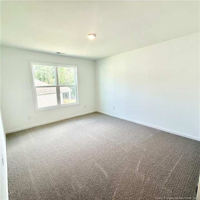 132 Cahill, Home, Raeford, NC 28376 - spare room featuring carpet floors and baseboards