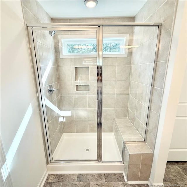 132 Cahill, Home, Raeford, NC 28376 - bathroom featuring a stall shower and baseboards