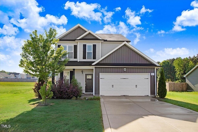 view of front of house featuring a front yard, driveway, a garage, and fence
