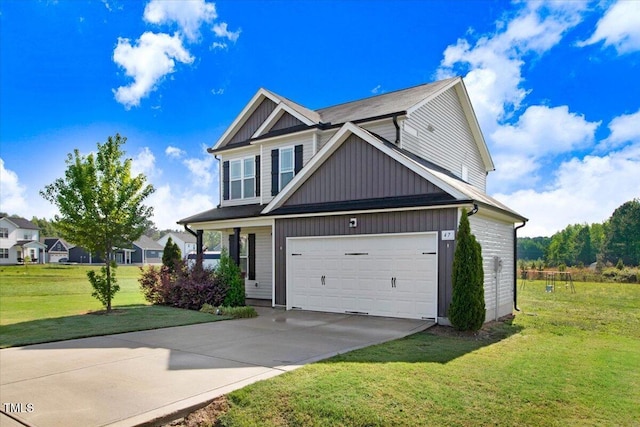 craftsman inspired home with a front lawn, driveway, and a garage