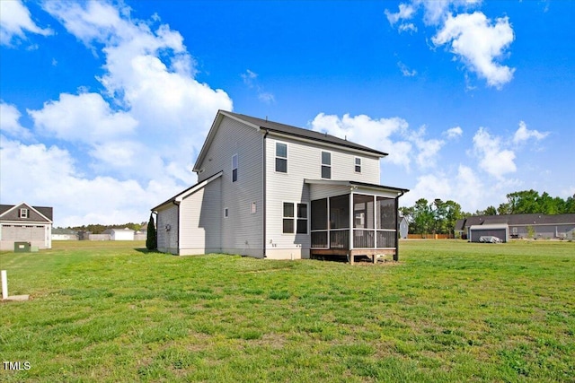back of house with a sunroom and a lawn