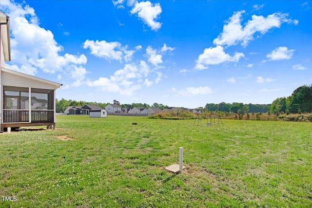 view of yard with a sunroom
