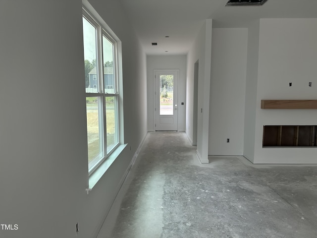 2874 Quarry Rd Unit 165, Rolesville, NC 27571 - hall with unfinished concrete flooring and baseboards